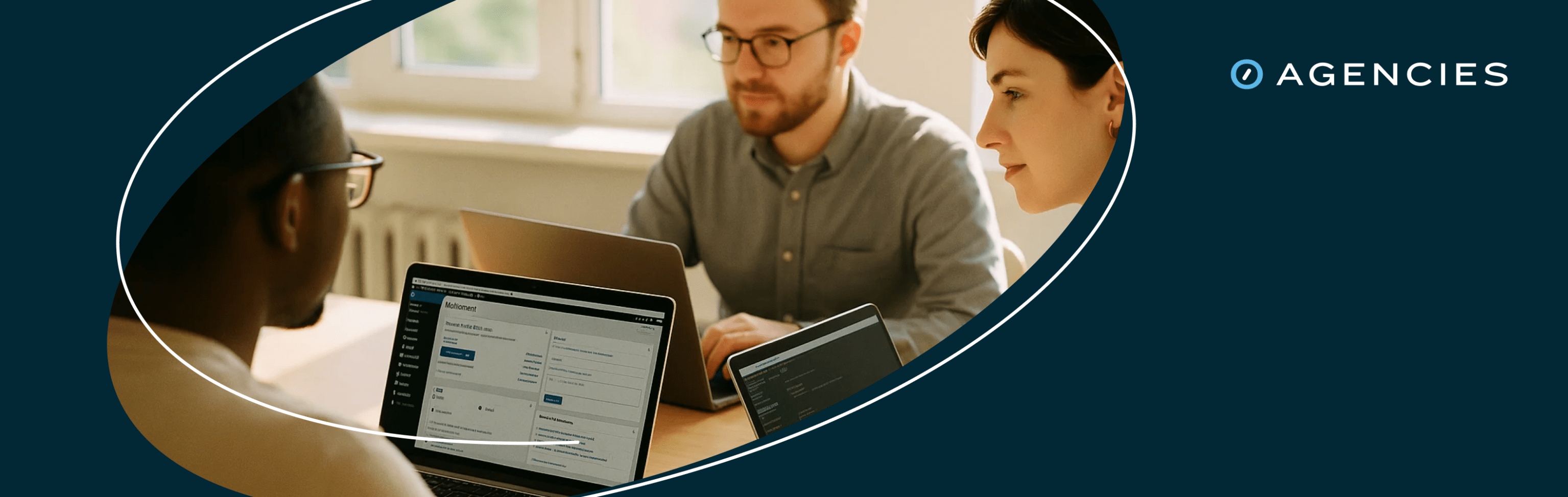 team of developers working around a computer