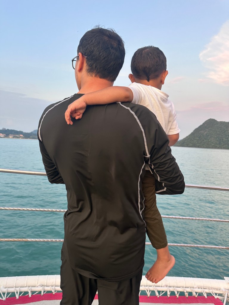 Manzoor and son enjoy a boat ride.